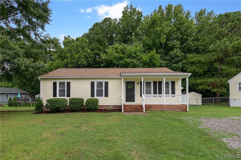 View of front of home with covered porch and a fro