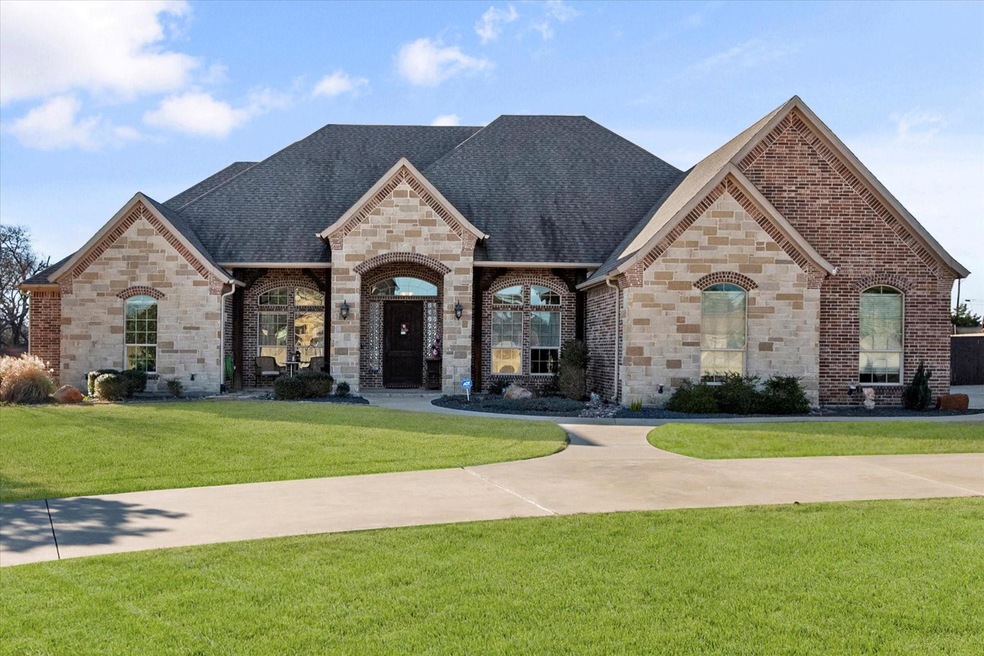 French country style house featuring a shingled ro