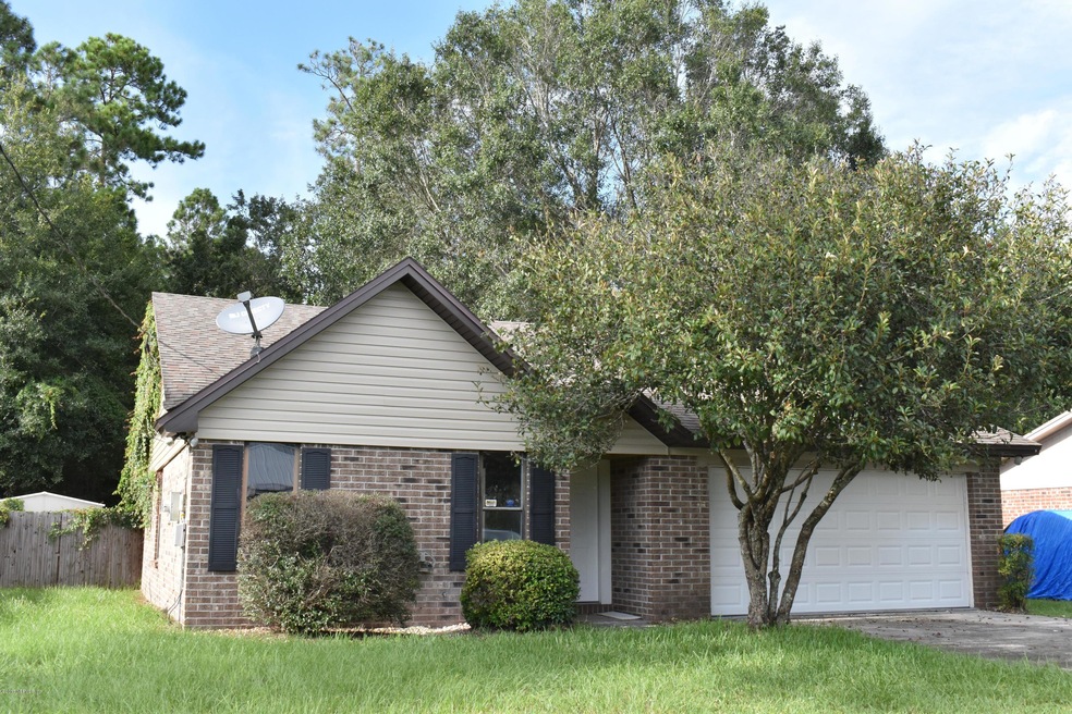 7679 Gregory Dr, Jacksonville, FL 32210 - photo 1