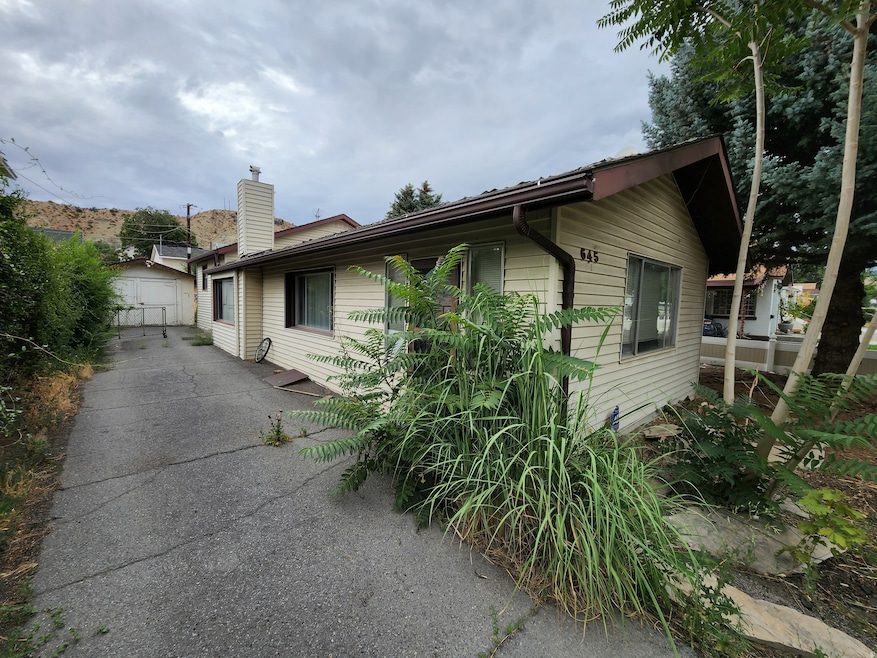 View of side of property with a chimney