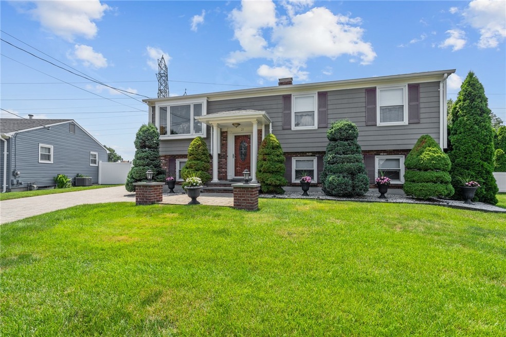 Front w/manicured landscaping
