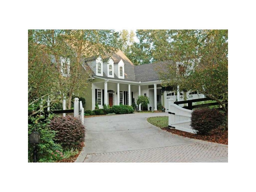 Exterior Front. Charming Cape Code with gated driv