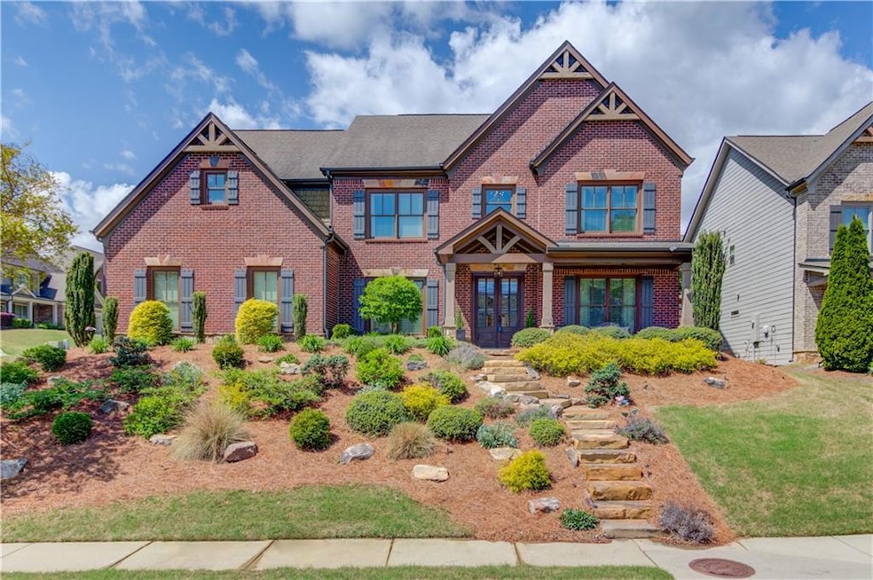 Craftsman-style home featuring brick siding and fr
