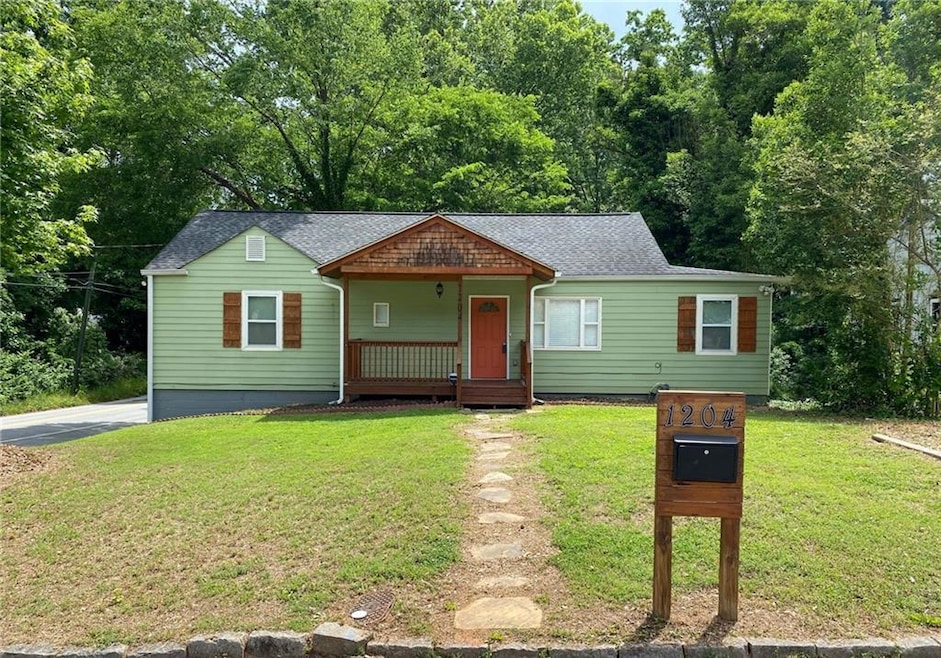 View of front facade with covered porch, a front l