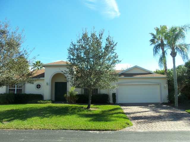 Exterior Front. Mature Landscaping and Paver Drive