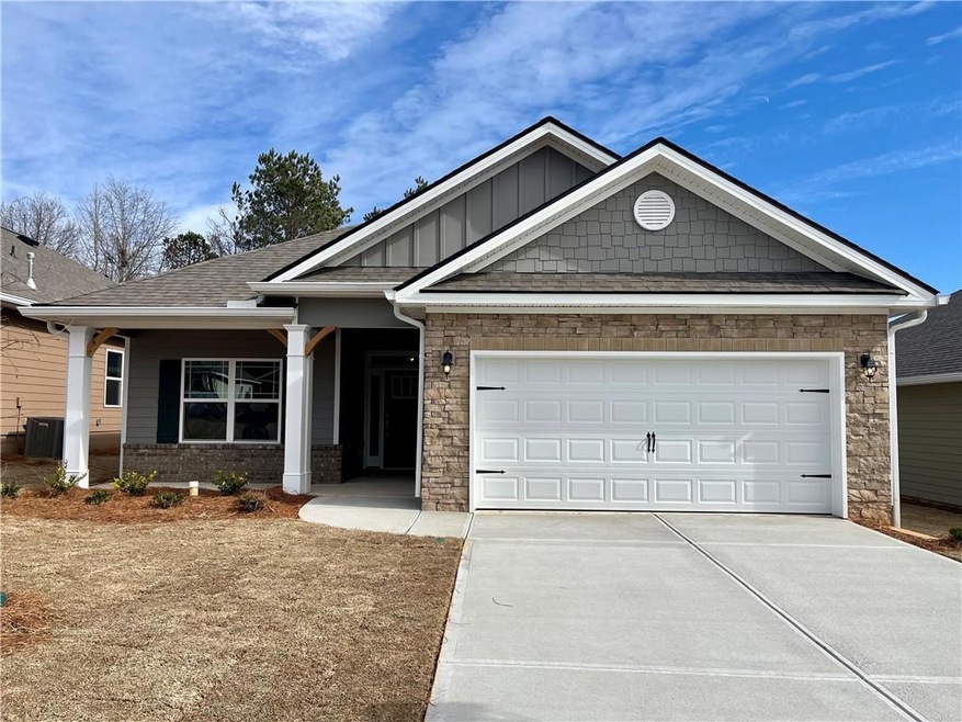 Craftsman-style house with a garage and central ai