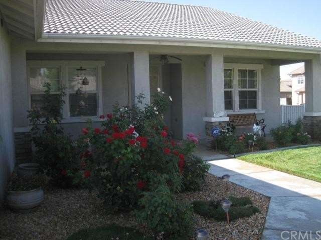 Beautiful Roses line the Walkway to the Front Door
