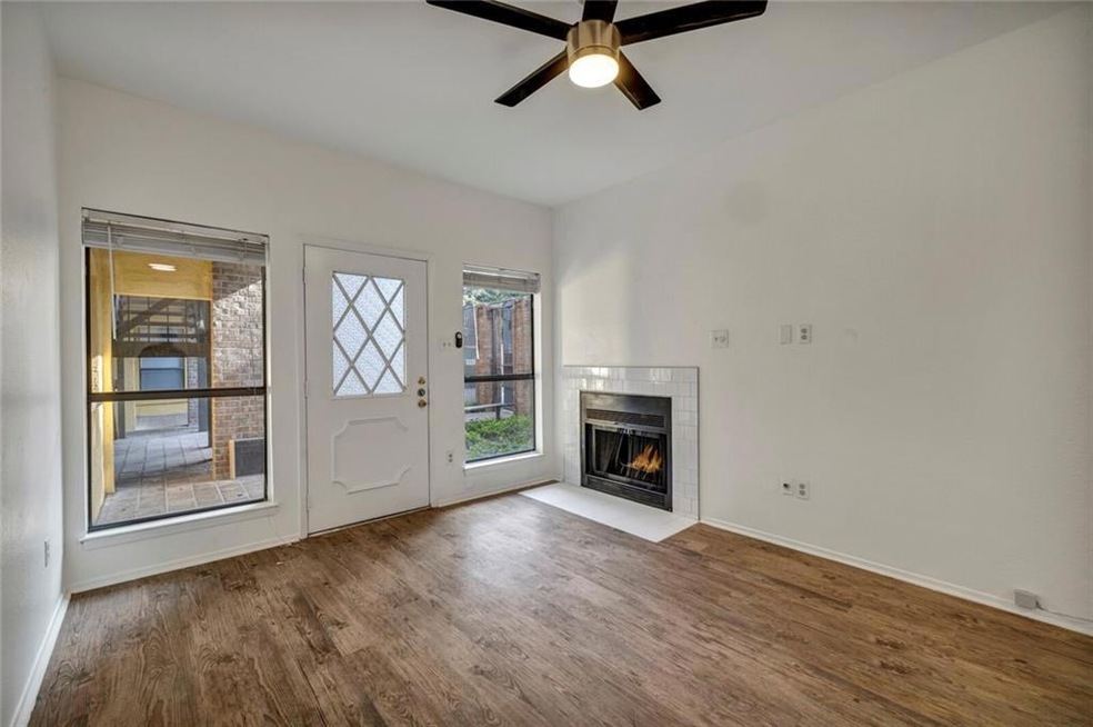 Unfurnished living room with wood finished floors