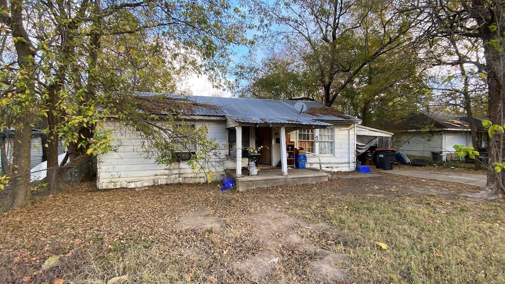 View of front of property with a metal roof and a porch
