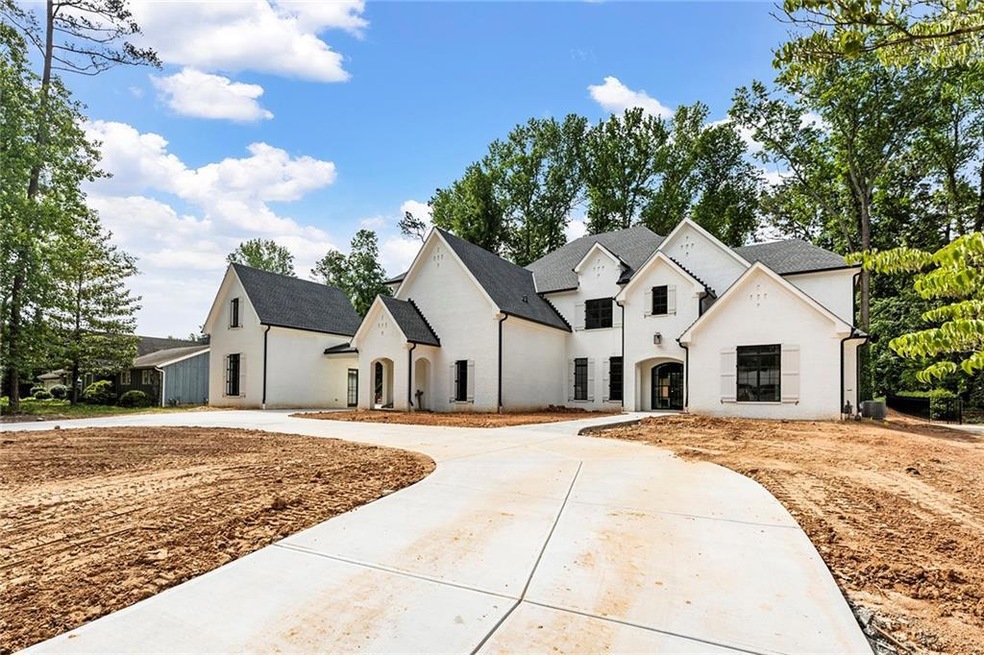 French country inspired facade circle drive way