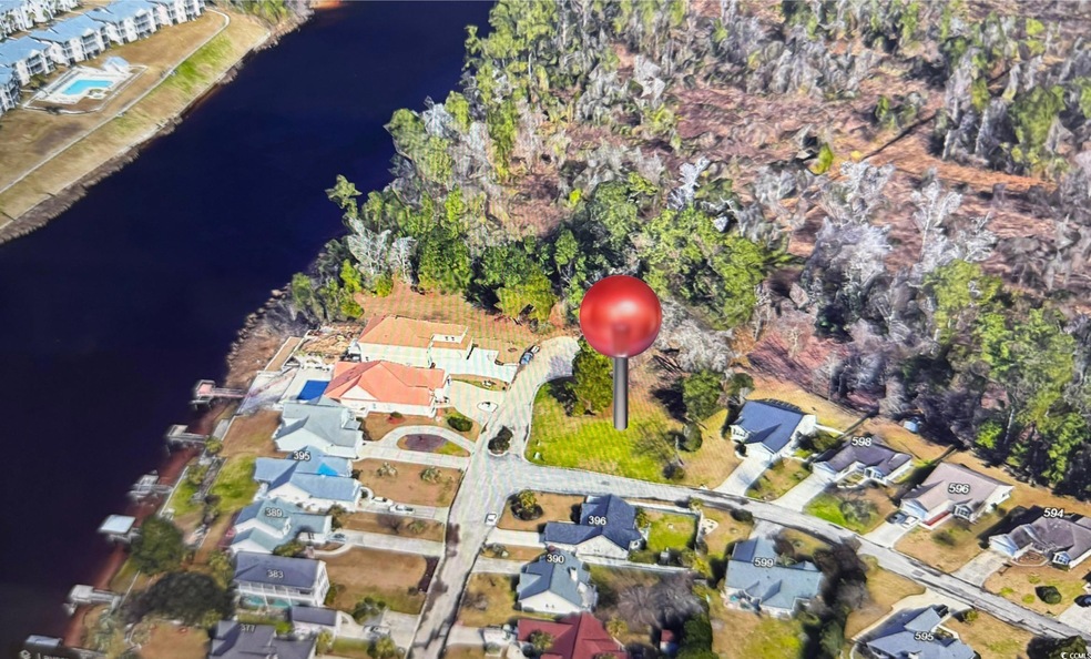 Bird's eye view featuring a water view and a resid
