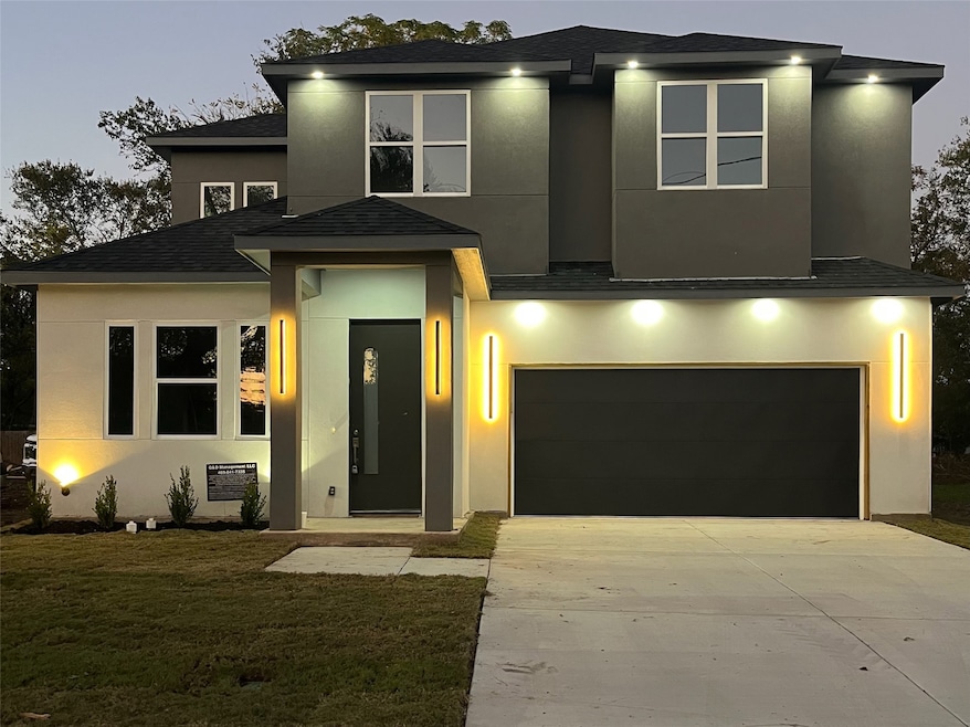 Modern home with stucco siding, a front lawn, and a garage