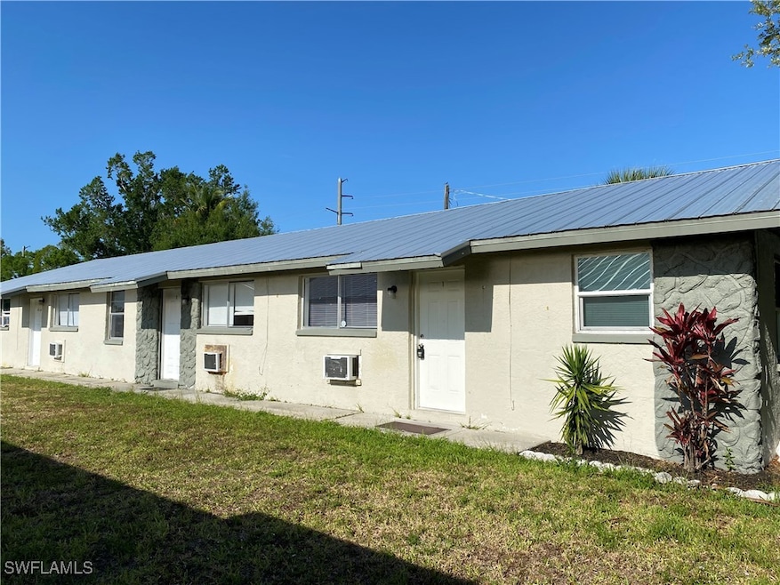 View of front of house with stucco siding, a front