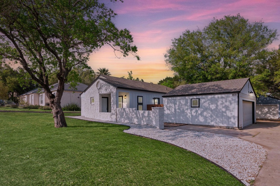 Ranch-style house with an outbuilding, driveway, 