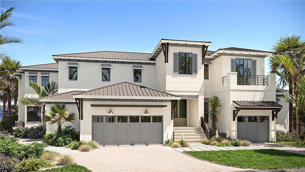 View of front facade featuring a balcony, driveway