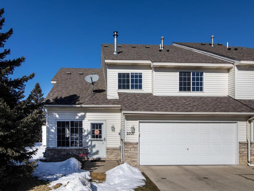 South facing end unit with attached 2 car garage.