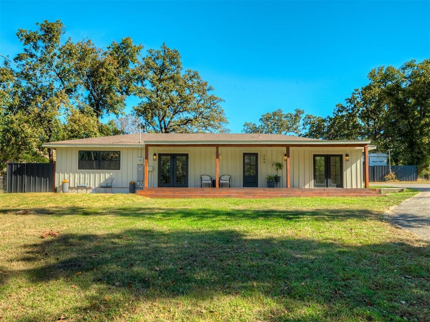 View of front of house with french doors, board and batten siding, and a porch