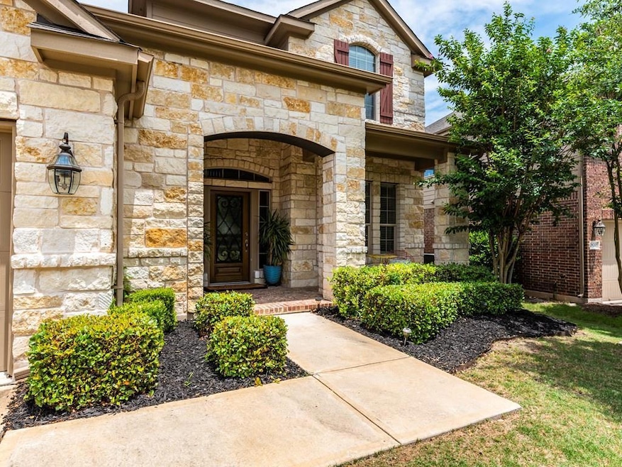 Doorway to property featuring stone siding
