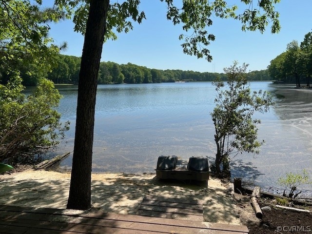 Dock area featuring a water view