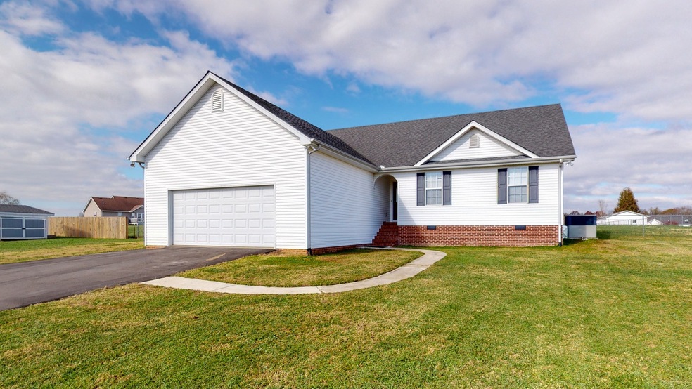 Sellers added and extra 20ft to widen driveway. More parking, RV parking, more space for 