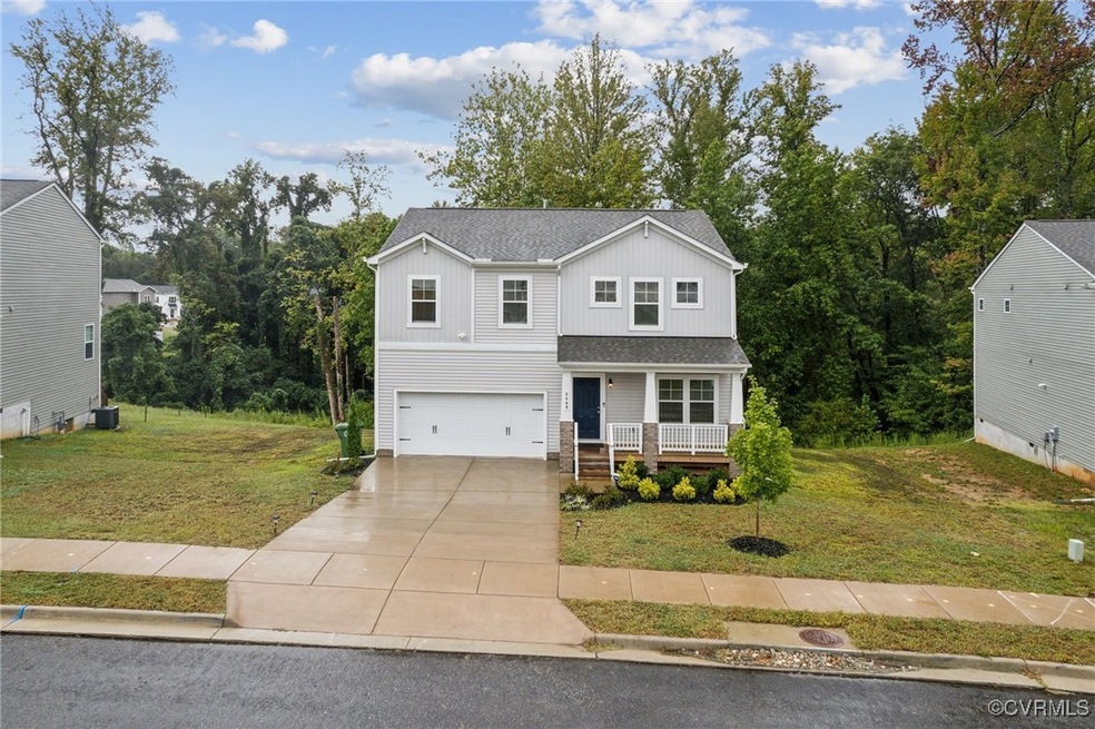 View of front of house featuring a front lawn, cov
