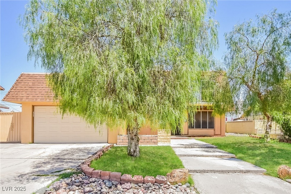 Obstructed view of property with concrete driveway