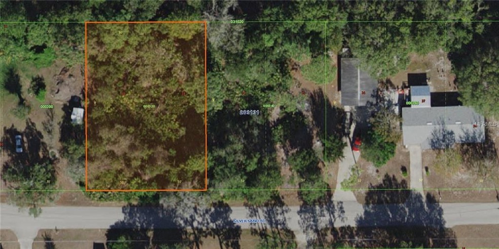 Paved Road for a residential vacant lot with Lake 