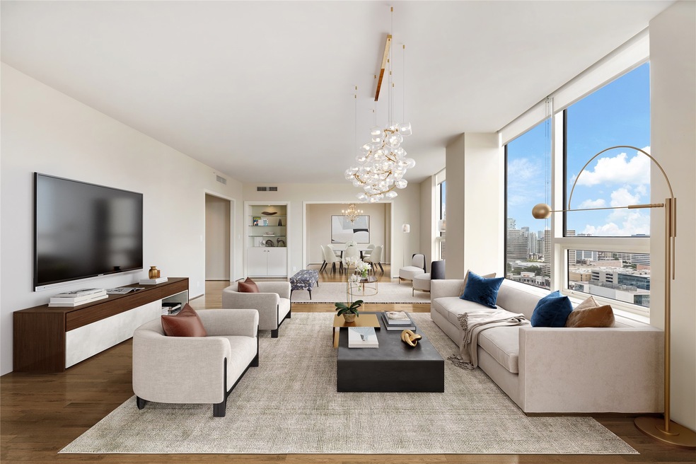 Spacious living room shown virtually staged.