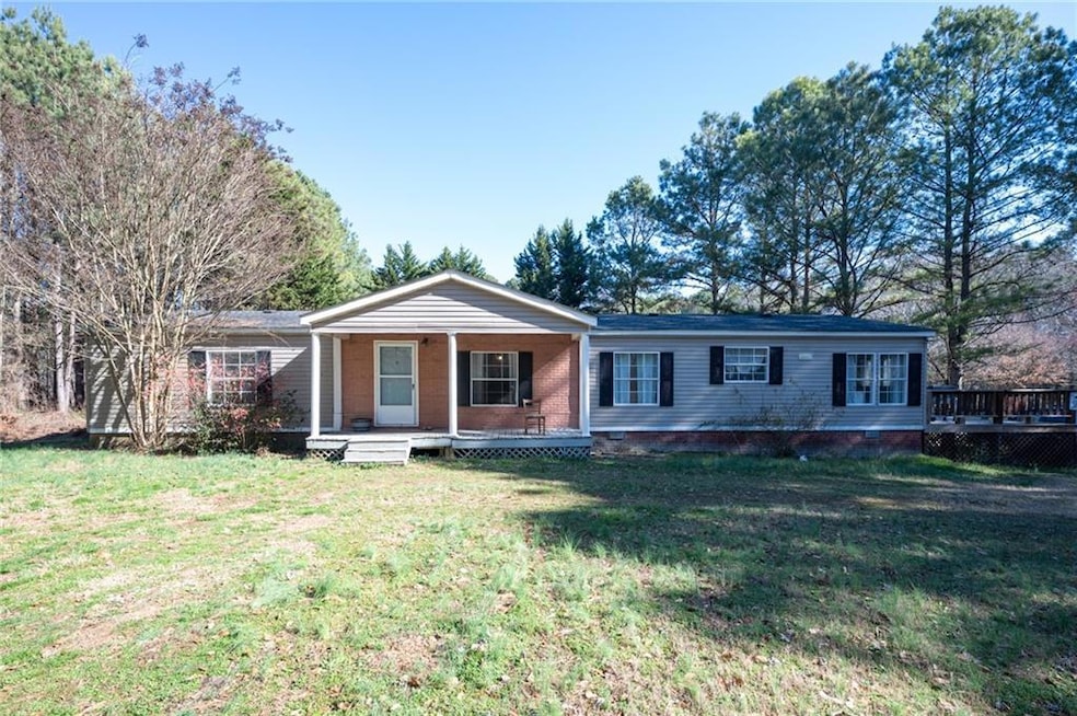Ranch-style home featuring a porch, crawl space, a