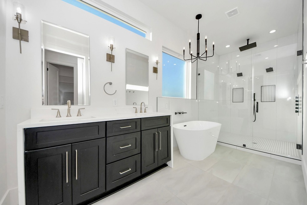 Elegance flows throughout the sleek bathroom, cent