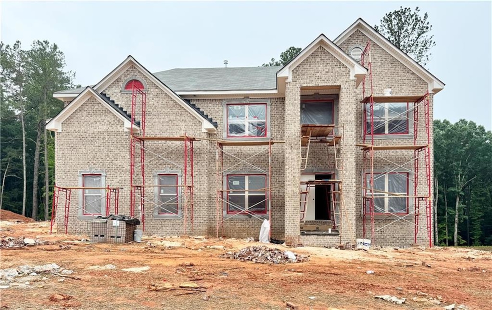 Back of property featuring brick siding