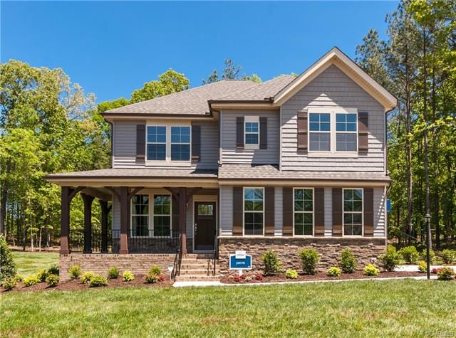 HOME IS NOT BUILT. Photo is from the builder's library and is similar to the home being built on this homesite. Colors, features and options will vary. Home being built has a front porch but not the wrap porch shown in this photo.