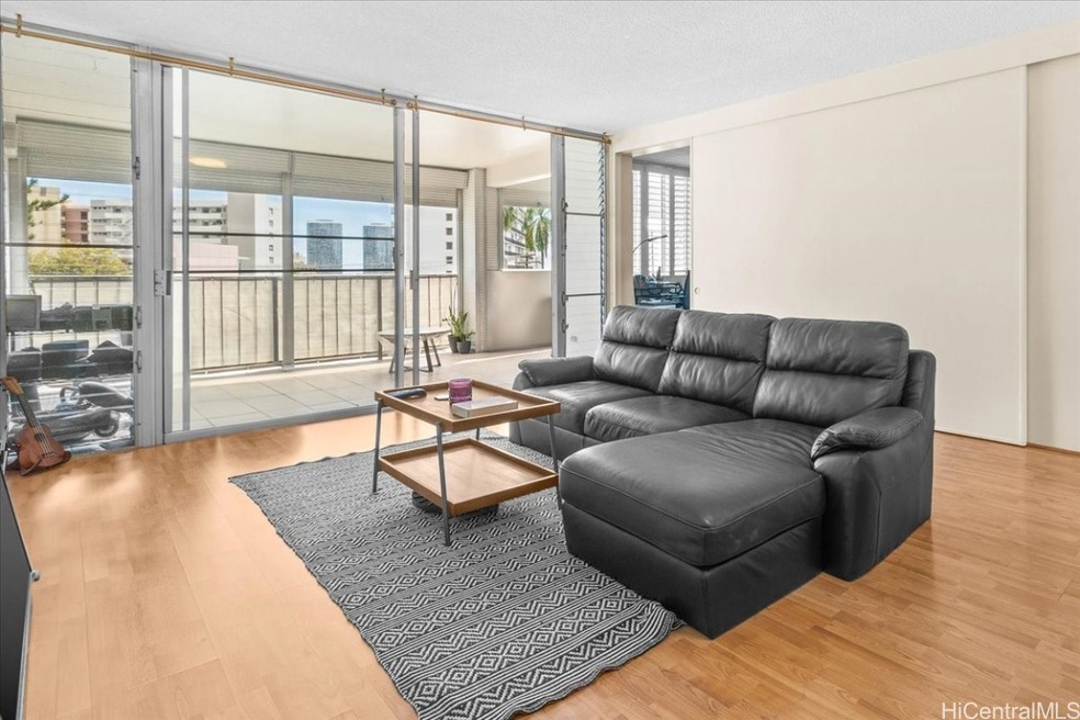 Spacious living room with laminate floors and lots