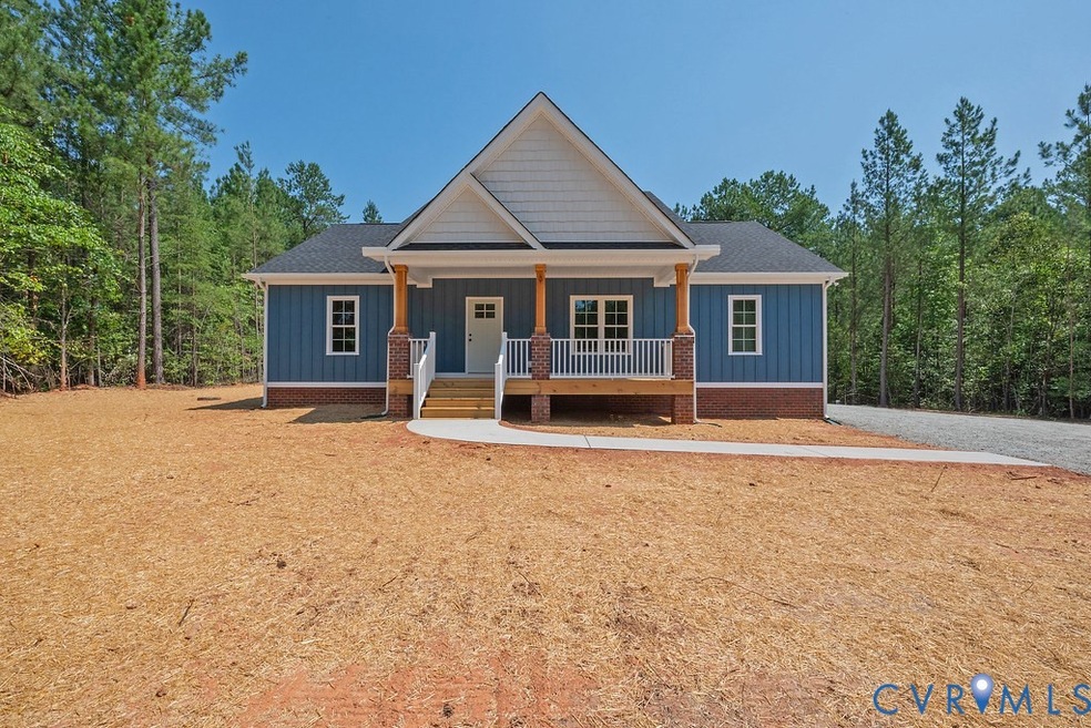 View of front facade with board and batten siding and covered porch