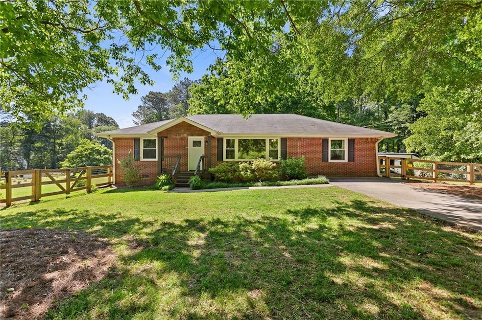 Ranch-style home with brick siding