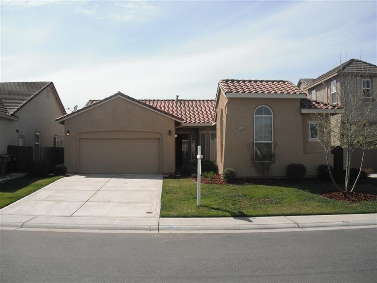 Nice single story home. Stucco and tile roof.