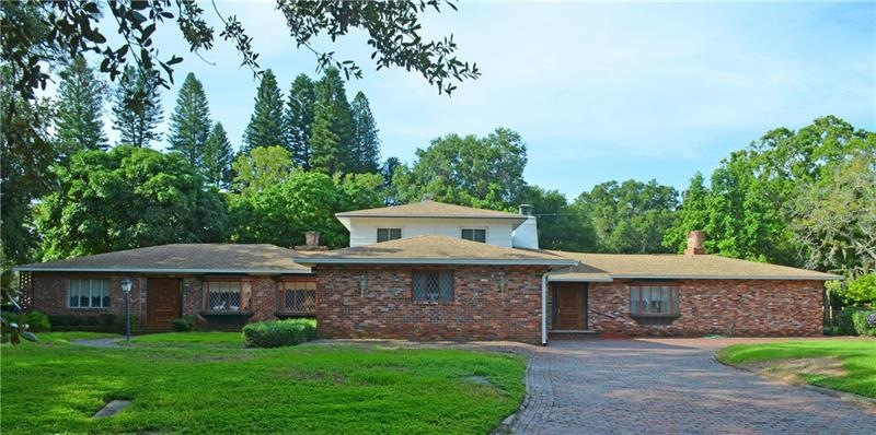 Massive brick home located on nine lots in the hea