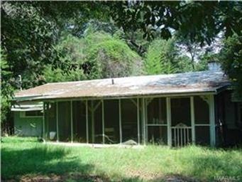 Front of the house with screened in porch.