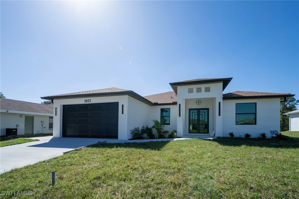 Prairie-style house with stucco siding, a front la