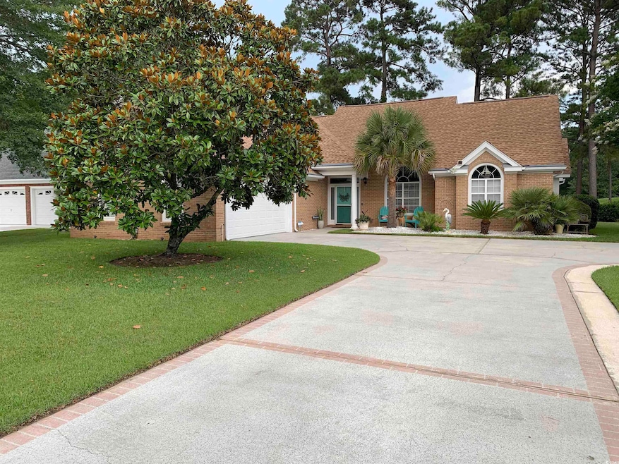 Beautifully landscaped brick home with lots of parking space and awesome curb appeal!