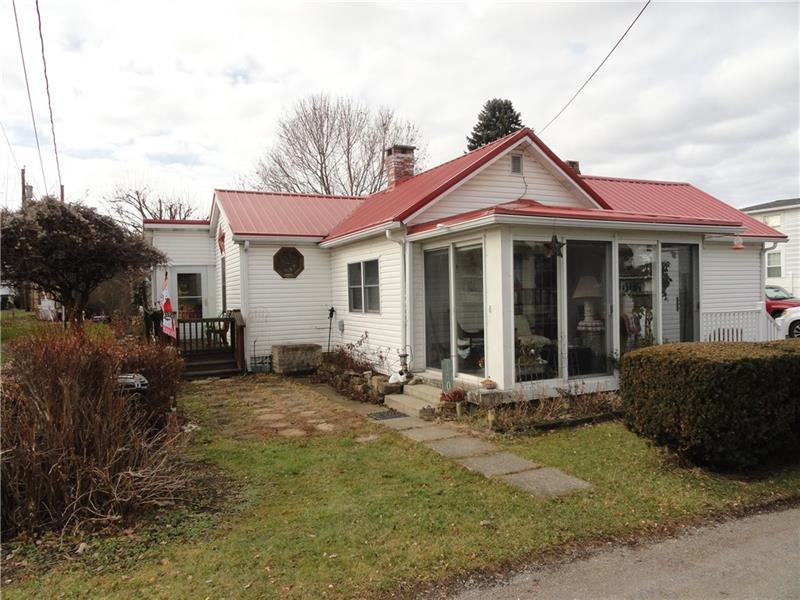 Great ranch with front sun room plus side deck. Ne