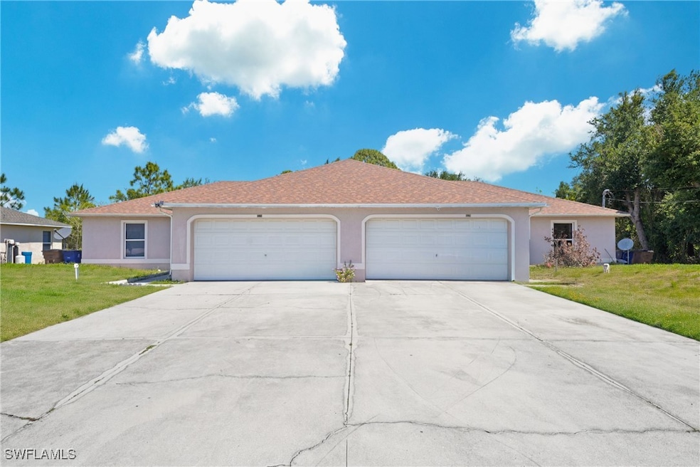 Ranch-style home with stucco siding, concrete driv