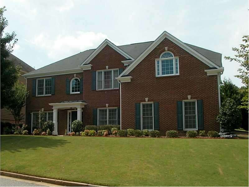 Exterior Front. Peachtree built brick home nearly 