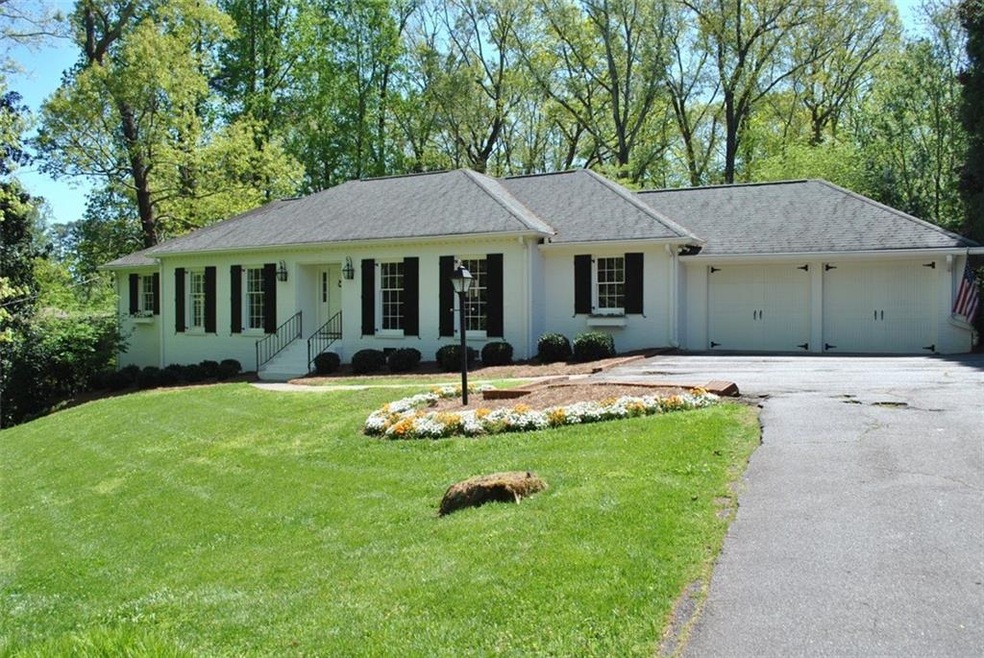 Charming painted brick ranch situated on large lot