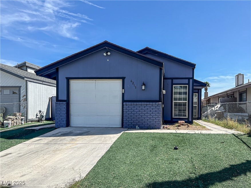 Single story home featuring driveway, brick siding, fence, a front lawn, and an attached garage