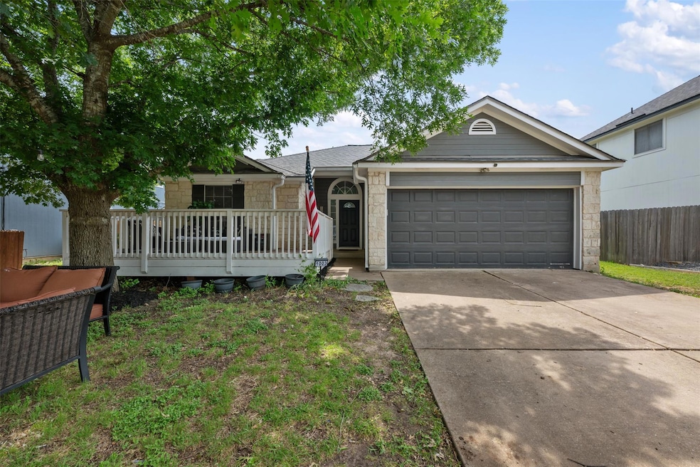 Single story home with an attached garage, drivew