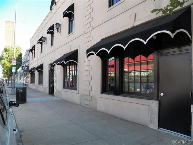 Building Front showing entry door to Apartments. M