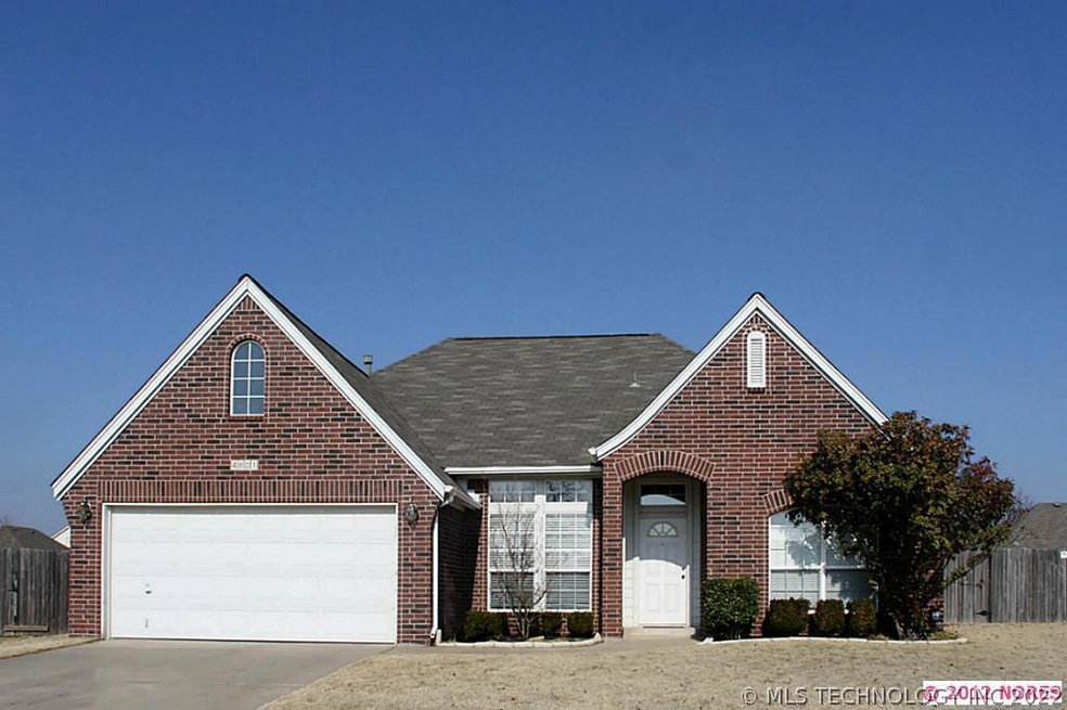 This beautiful brick one-story home is on a cul-de