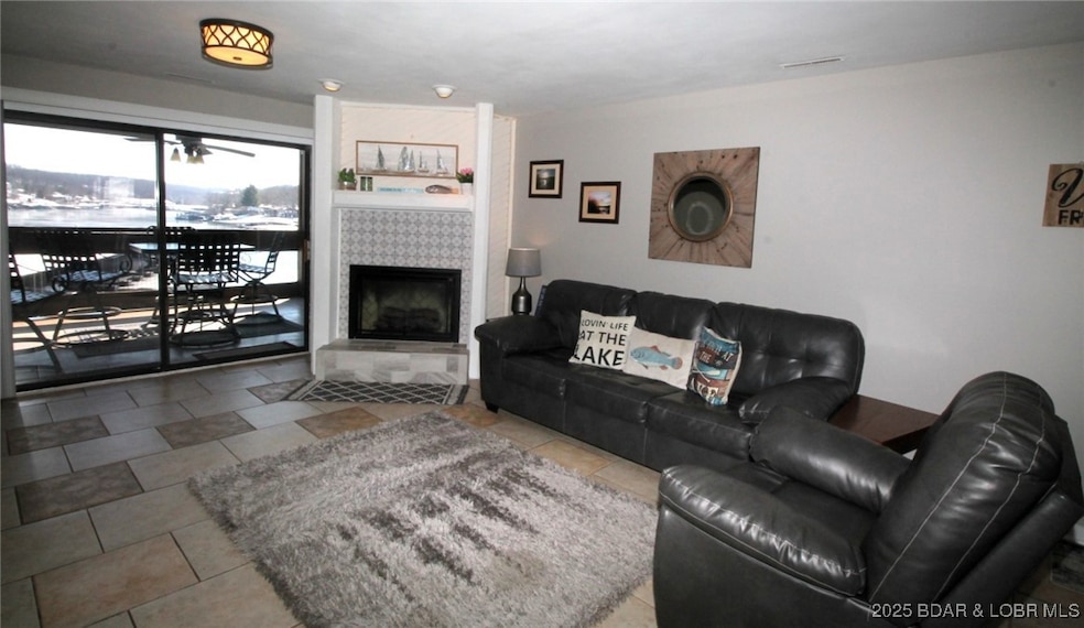Enjoy the beautiful lake view from a cozy living r