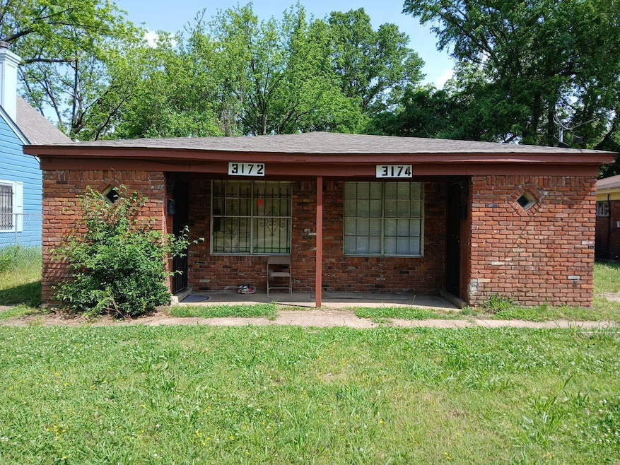 Ranch-style home featuring a front yard, brick siding, and a porch